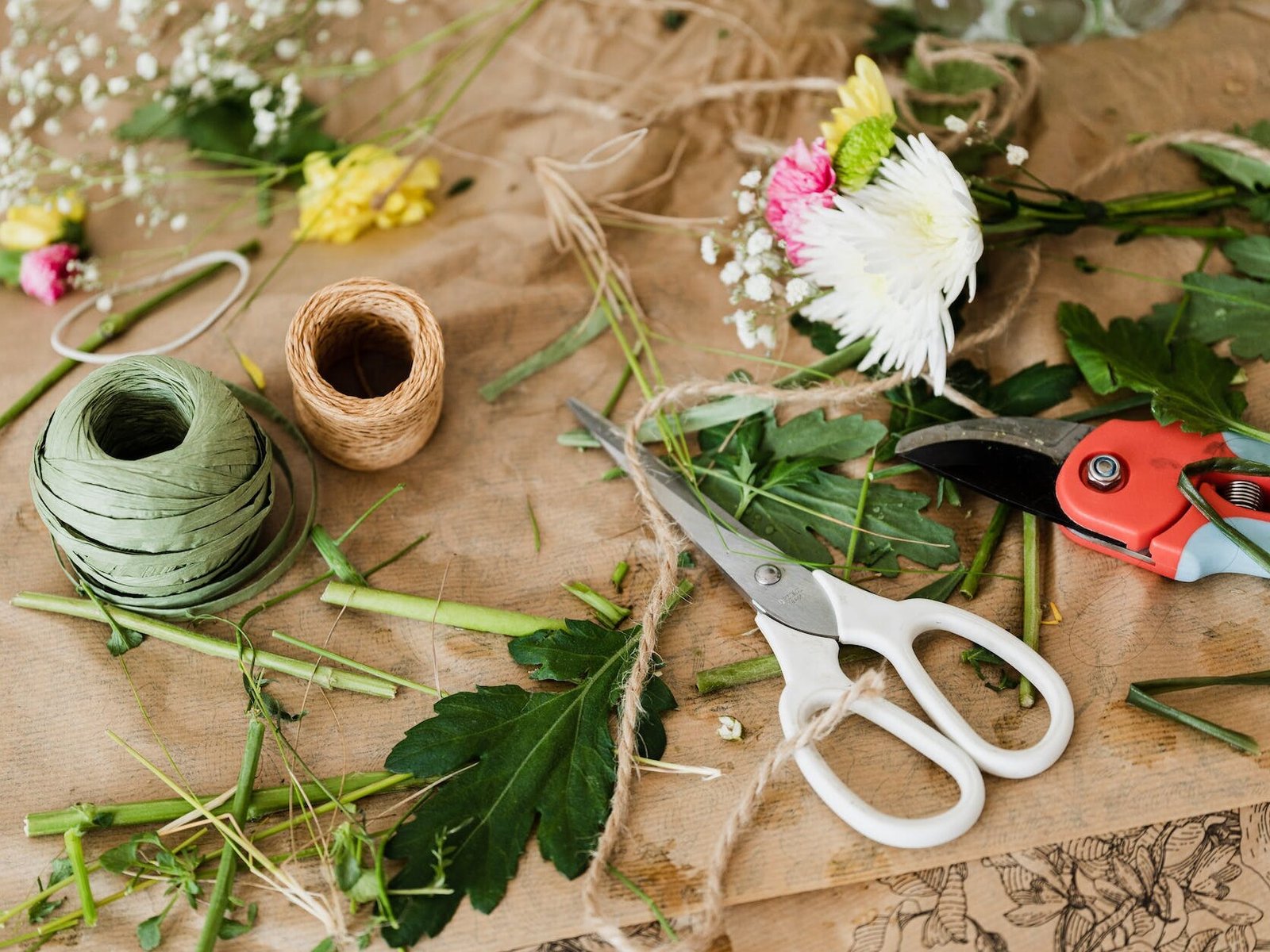 pruners and scissors together with twine in florist shop